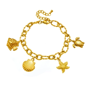 Gold plated stainless steel ocean charm bracelet featuring starfish and turtle pendants