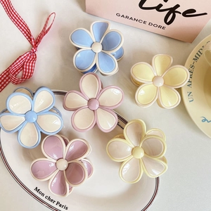 Set of six colorful floral hair claws in pastel macaron shades for women's hair styling