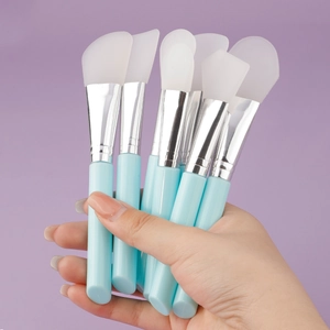 Set of 8 silicone face mask brushes with light blue handles and soft translucent tips
