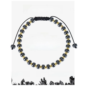 Detail view of woven hematite stone bracelet with gold beads on grounding energy card