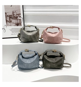 Four minimalist strawberry print shoulder bags shown in gray, pink, blue, and dark gray