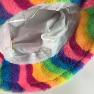 Detail of colorful plush bucket hat showing faux fur texture and white fabric lining