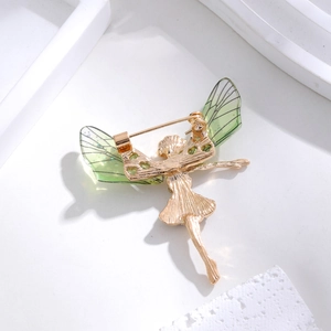 Vintage fairy dragonfly brooch with golden metal pins and green glitter wings