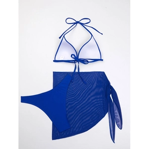 Detailed flat lay of blue three-piece halter bikini set with mesh beach skirt