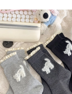 Detail of sweet Japanese style cotton socks with white lace trim and kitten flocking