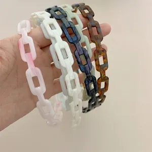 Set of four acrylic chain headbands in marble pink, white, iridescent, and tortoiseshell