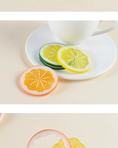 Macro detail of artificial PVC lemon and lime slices with realistic pulp texture