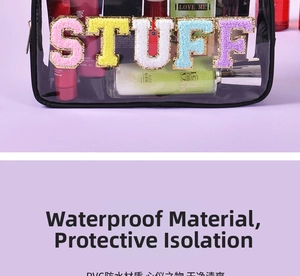 Detail of waterproof PVC toiletry bag with STUFF chenille embroidery and black trim