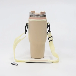 Detailed view of beige 40oz tumbler pouch with adjustable shoulder strap and black carabiner