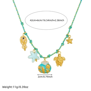 Detail showing ocean-themed charms on braided necklace with starfish shell and turtle