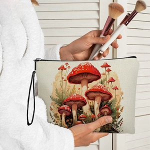 Portable canvas makeup bag with vintage mushroom print and black zipper handle strap
