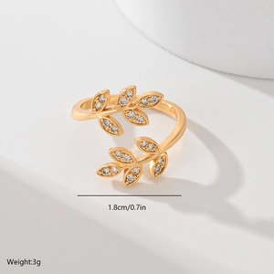 Fashionable gold leaf open ring with zircon stones shown from a close-up angle
