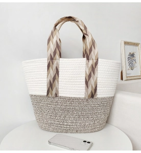 Detail of bohemian cotton rope tote with dual-tone weave and herringbone patterned straps