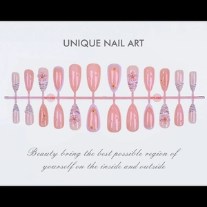Detailed view of 24pcs pink zebra press-on nails with 3D floral and pearl accents