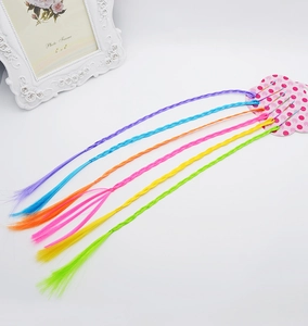 Close-up of six colorful braided synthetic hair extensions for children hair styling