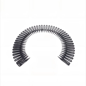Close-up of black plastic zigzag headband hair comb with flexible sawtooth design