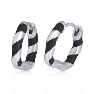 Detailed view of silver earrings with black spiral stripes and secure clasp closure