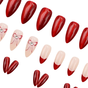 Elegant wine red cat eye press-on nails with bow designs and crystal accents