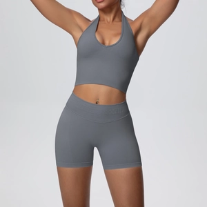 Detail of charcoal grey seamless knitted yoga set with halter bra and high-waist shorts