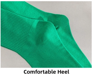Detail of green cotton knit socks showing reinforced heel and ribbed texture craftsmanship