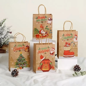 Set of four festive Christmas kraft paper gift bags with handles and holiday patterns