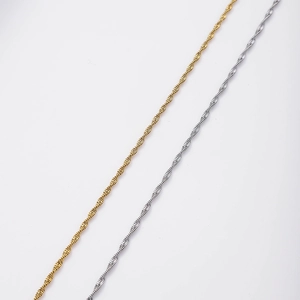 Detailed macro view of gold and silver stainless steel twisted rope chain necklaces