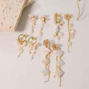 Baroque pearl earrings collection with gold tassels and floral studs for women