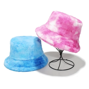 Winter faux rabbit fur bucket hats in light blue and pink tie-dye gradient styles