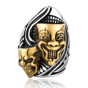 Punk style dual-tone mask and skull ring in polished silver and gold stainless steel