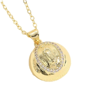 Golden religious pendant with Our Lady of Guadalupe relief and clear rhinestones