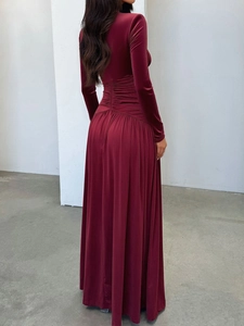 Elegant deep red velvet maxi dress with long sleeves and gathered waist, back view