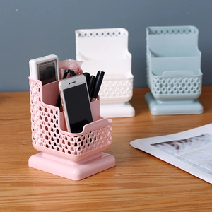 Pink rattan-style plastic desk organizer with multiple compartments for pens and remotes