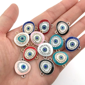 Close-up of colorful evil eye connectors with rhinestones for DIY jewelry making