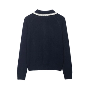 Women's dark blue knit sweater with delicate white lace collar trim and raglan sleeves