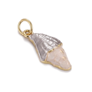 Detailed macro shot of conch shell pendant with gold ring and silver metallic texture
