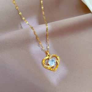 Luxury titanium steel heart necklace with cubic zirconia on elegant beige silk fabric