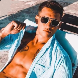 Detail of steampunk polygonal sunglasses with metal frames worn by male model