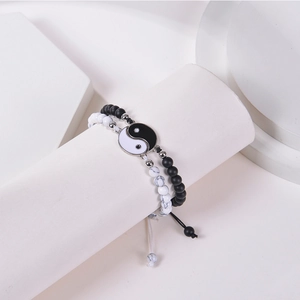 Detail of Yin Yang magnetic bracelets with matte black and white marble beads on display