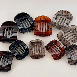 Collection of ten vintage tortoiseshell and marble acetate hair clips in varied colors