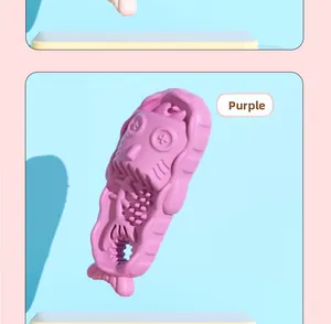 Detailed view of the purple fish-shaped TPR dog toy with tooth cleaning ridges