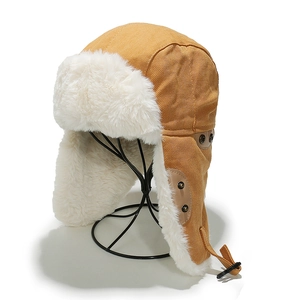 Detail of winter trapper hat with khaki canvas shell and thick white faux fur lining