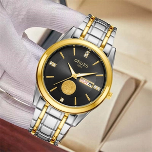 Detailed close-up of ORUSS quartz watch with golden eagle relief and dual calendar display