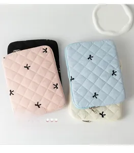 Quilted tablet sleeve with cute embroidered bows in black pink blue and white colors