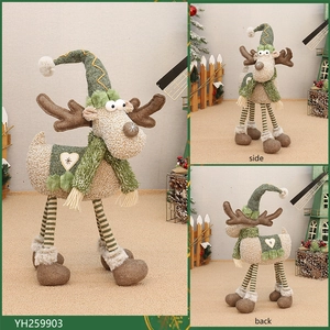Detailed views of plush reindeer Christmas ornament with striped legs and star heart patch