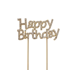 Golden Happy Birthday cake topper with sparkling rhinestones on a white background