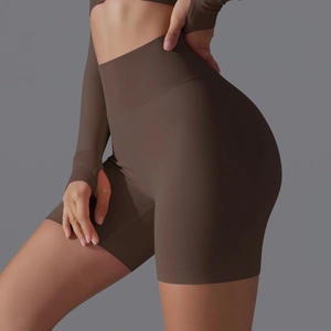 Detail view of seamless high waist yoga shorts and thumb hole top in dark coffee