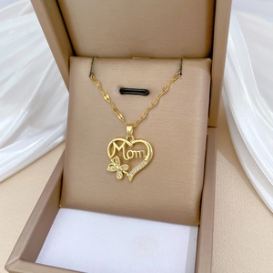Gold Mom heart pendant necklace with butterfly and crystals in a gift box packaging