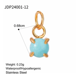 Detail view of turquoise pendant with gold interlocking rings and dimensions