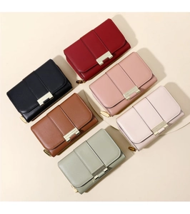 Multiple colors of minimalist women's short wallets with gold bar trim in high-quality faux leather