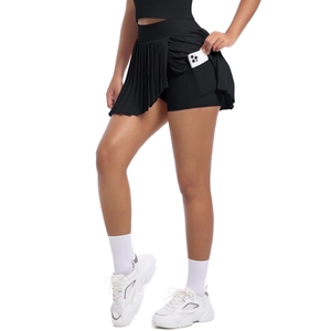 Detail of high waisted pleated tennis skort with functional side pocket for phone storage